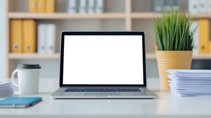 Fototapeta premium Modern Workspace with an Open Laptop, Coffee Cup, and Fresh Plant on a Desk Surrounded by Neatly Stacked Papers and Organized Binders in a Bright Office Setting