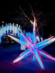 Fragments of New Year's glowing static structures. Central street is decorated with glowing...