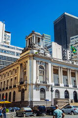 Fototapeta premium Brazil. In Rio de Janeiro, historic and modern buildings coexist under a clear blue sky, showcasing urban evolution.