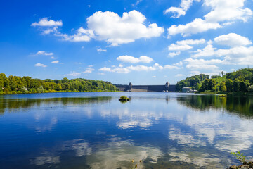 View of the historic dam wall at Möhnesee. Möhne Dam with the surrounding nature.
