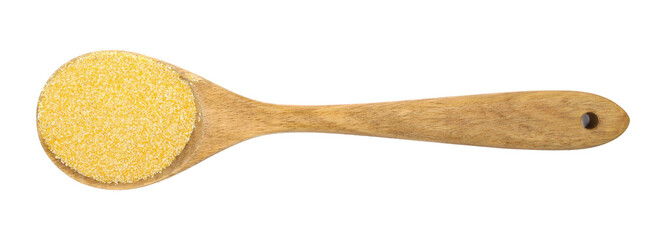 Corn polenta uncooked and wooden spoon isolated on white, top view, clipping path