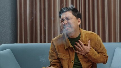Smoker holding his chest due to pain. Suffering from chronic respiratory issues while smoking. Health risks, lung cancer awareness, smoking consequences, addiction problems, respiratory distress