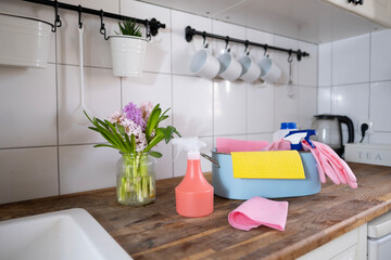 trough with cleaning items, household set in kitchen, spring home cleaning, wipes, detergents,...