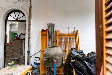 A room with a lot of clutter and a large pile of garbage