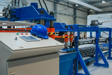 Production line in a metalworking factory with automated machinery. Modern industry and...