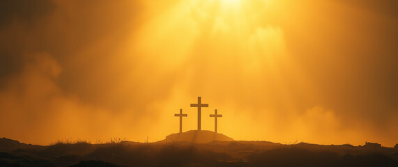 Three crosses on hilltop at sunrise symbolizing faith and resurrection