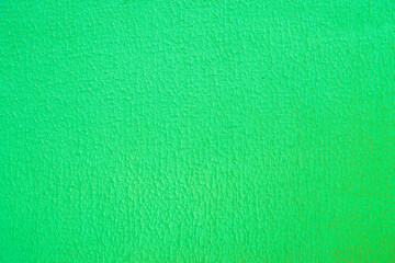 Green concrete wall close-up.