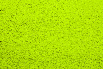 Abstract background of green plaster close-up.