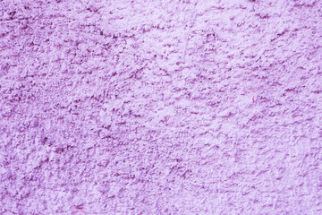 Abstract background of uneven, old plaster on the wall.