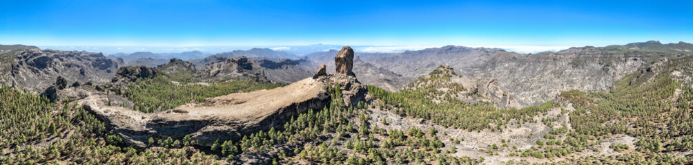 Aerial view of Roque Nublo, Gran Canaria. Large volcanic formation in Gran Canaria. Spain.
In the background the island of Tenerife with Teide the volcano.