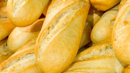 Close-up of freshly baked French baguettes capturing the essence of artisanal baking for...