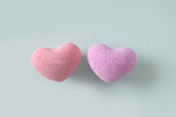 Valentine's Day two heart shaped bath salt on pastel blue background. View from above. Love concept.