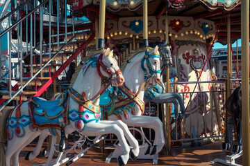 Carousel with colorful horses, Merry go round with horse, Vintage ride attraction for children