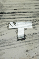 black tire marks on the asphalt with t letter