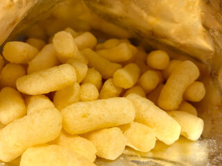 Cheesy snack delights in a crinkly bag ready for munching enjoyment