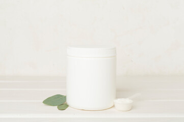 Jar with protein powder on wooden table. Sports nutrition concept