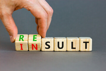 Result or insult symbol. Concept words Result Insult on wooden cubes. Beautiful grey table grey...