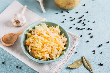 Homemade fermented cabbage in a bowl on the table