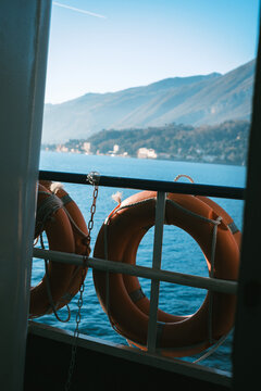 Lifebuoys on a Ferry with Scenic View of Lake Como