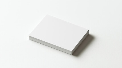 Fototapeta premium A blank card mockup positioned on a clean white surface, featuring ample space for adding a personalized logo, design, or message in a simple and elegant layout.