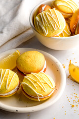 Homemade round lemon cookies. French sweet yellow cookies macarons