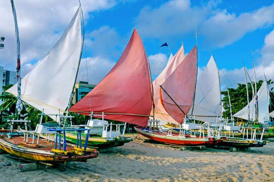 Rafts in Paju&ccedil;ara Beach, typical sail and rustic boat used for fishing and tourist transportation. Macei&oacute;, Alagoas State, Brazil, 2016