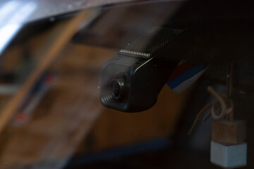 The DVR in the car is mounted on the windshield.