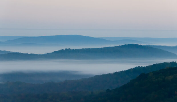 Mountain range on misty morning.  Beautiful view of rolling hills in mist. Scene of Appalachian foothills from viewpoint.