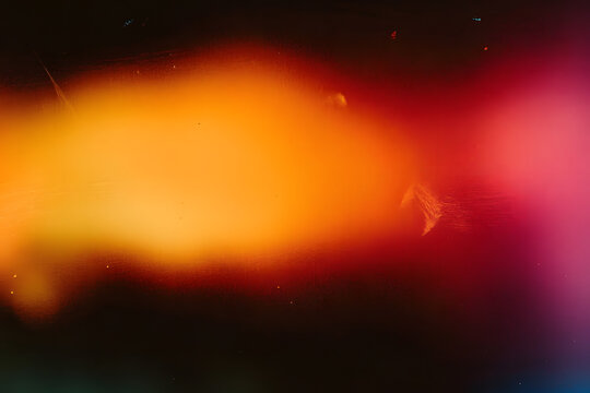 Blur colorful warm rainbow light leaks on black background with dust texture. Defocused abstract damaged scratched retro film analog effect for using over photos as overlay or screen filter - Powered by Adobe