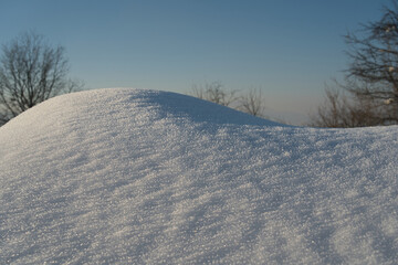 A picturesque winter scene of snow in a rural area, featuring both modern and retro elements in a serene natural setting.Christmas, Holidays, Childhood, Crystals, Ice