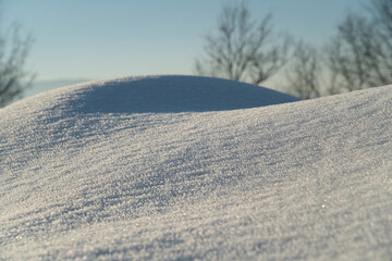 A picturesque winter scene of snow in a rural area, featuring both modern and retro elements in a serene natural setting.Christmas, Holidays, Childhood, Crystals, Ice