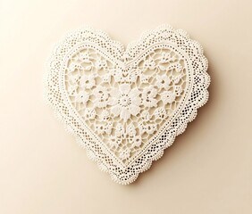 A heart-shaped lace doily with intricate floral patterns and delicate edging, placed on a soft beige background