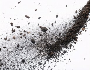 Abundant splashes of sand and gravel appear to float in the air against the white background