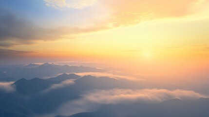 Stunning sunrise over misty mountain range.