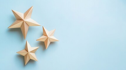 Obraz premium Wooden stars on a pastel background.