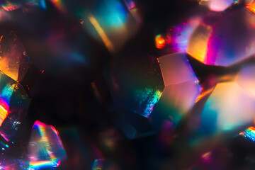 Blur colorful rainbow crystal light leaks on black background. Defocused abstract multicolored retro film lens flare bokeh analog photo overlay or screen filter effect. Glow Vintage prism colors