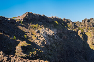 Steam emissions from fumaroles on the rocky slopes of Mount Vesuvius, an active volcano near Naples, Italy