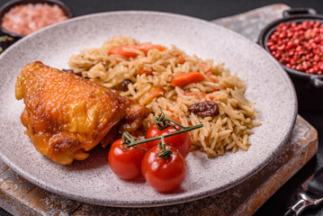 Delicious fresh pilaf with rice, carrots, meat, onions, spices and berries