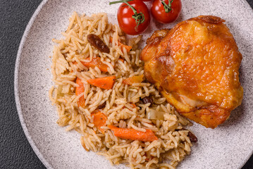 Delicious fresh pilaf with rice, carrots, meat, onions, spices and berries