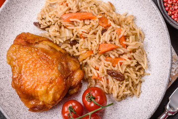 Delicious fresh pilaf with rice, carrots, meat, onions, spices and berries