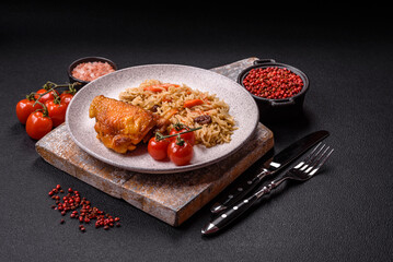 Delicious fresh pilaf with rice, carrots, meat, onions, spices and berries