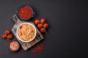 Delicious fresh pilaf with rice, carrots, meat, onions, spices and berries