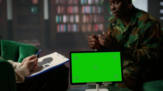 Military soldier experiences shell shock at counseling next to copy space, dealing with trauma recovery and share his feelings. Army trooper with PTSD and combat flashbacks scenes. Camera A.