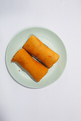 Risoles or risoles, is a traditional Indonesian snack. It contains mayonnaise mixed with eggs, sausage, vegetables and sometimes chopped chicken, sprinkled with breadcrumbs and fried.