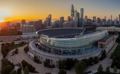 Chicago's Wrigley Field at sunrise, empty stadium, city skyline. Soldier Field, Chicago, Illinois, United States