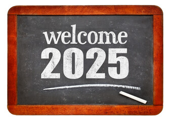 Welcome 2025 - New Year concept on a vintage slate blackboard isolated on white