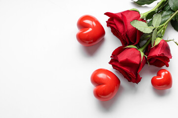 Beautiful roses with hearts on white background. Valentine's Day celebration