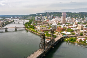 Fototapeta premium Aerial View of Portland Cityscape with Steel Bridge and Willamette River