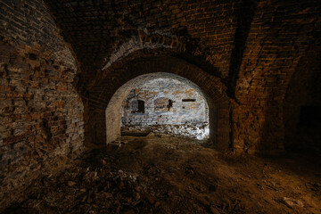 Dark and creepy vaulted red brick dungeon