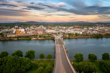 Fototapeta premium Various day and sunset drone scene of Portland Oregon, Willamette river and downtown, Aerial drone footage